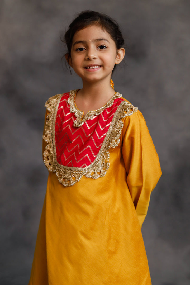 Yellow and Pink Asymmetric Kurta With Pants Set