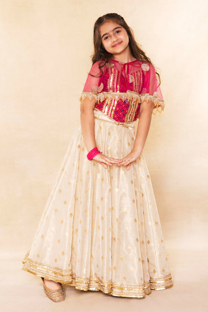 Fuchsia Corset Blouse With Embellished Cape and Gold Tissue Lehenga Set