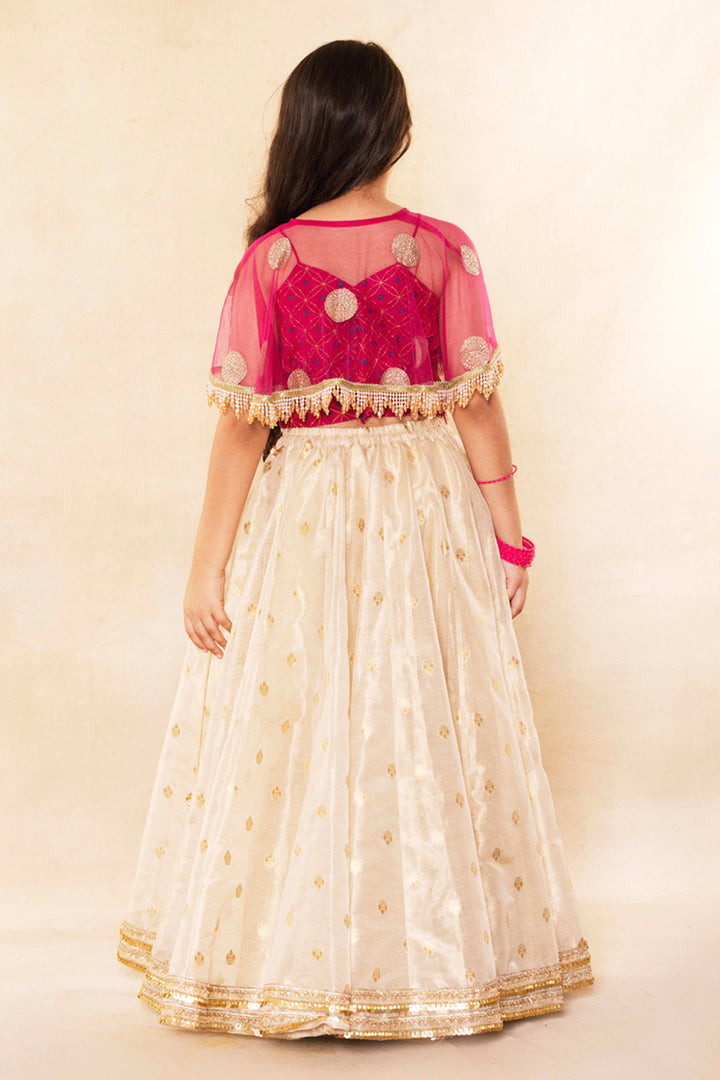 Fuchsia Corset Blouse With Embellished Cape and Gold Tissue Lehenga Set