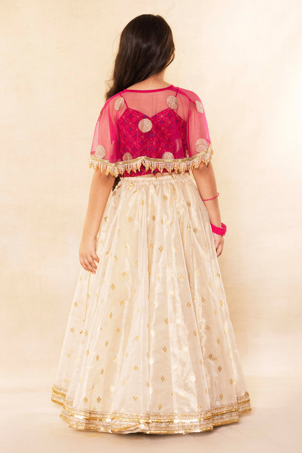Fuchsia Corset Blouse With Embellished Cape and Gold Tissue Lehenga Set