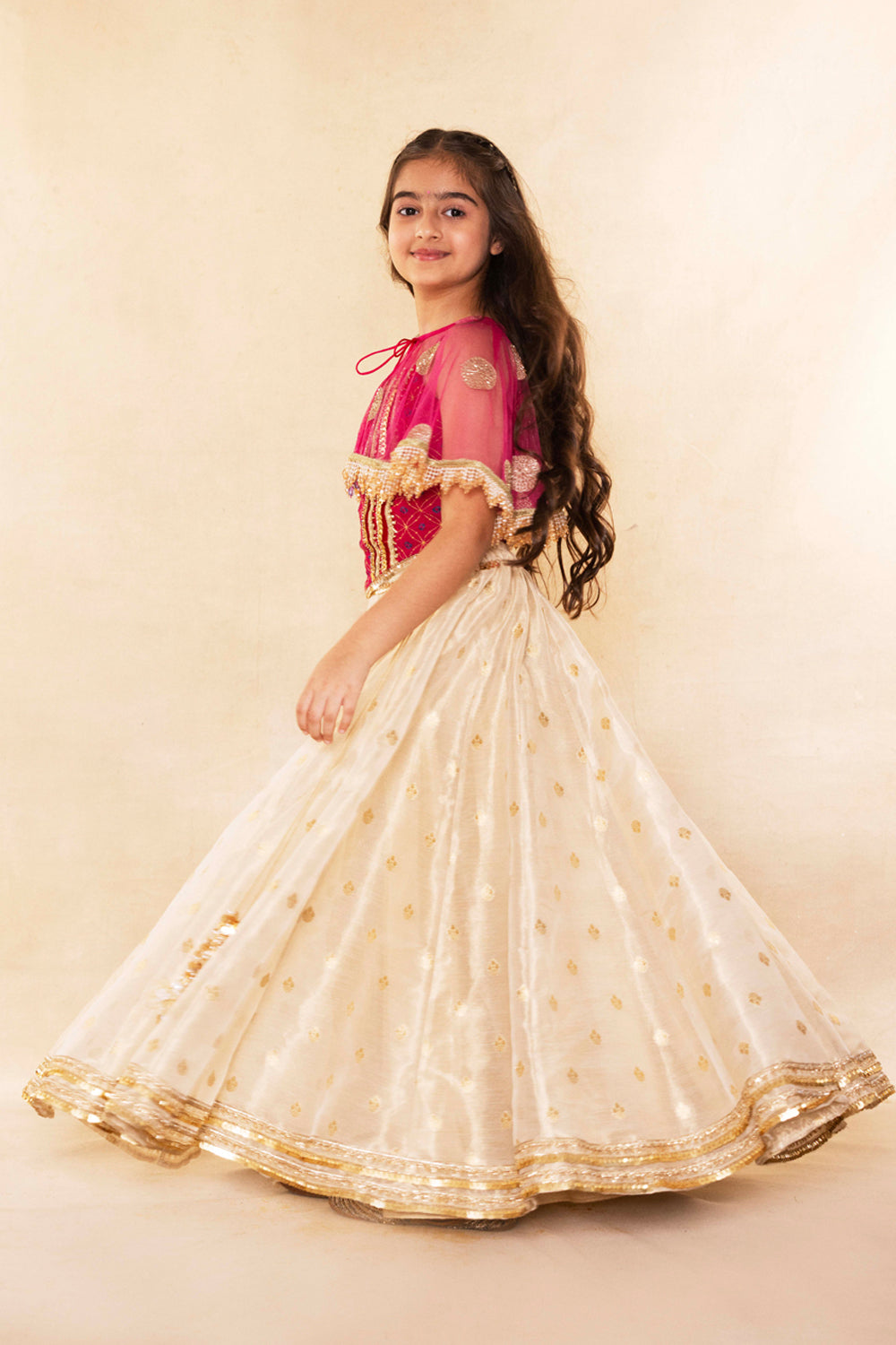 Fuchsia Corset Blouse With Embellished Cape and Gold Tissue Lehenga Set