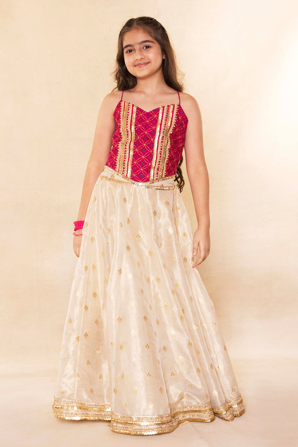 Fuchsia Corset Blouse With Embellished Cape and Gold Tissue Lehenga Set