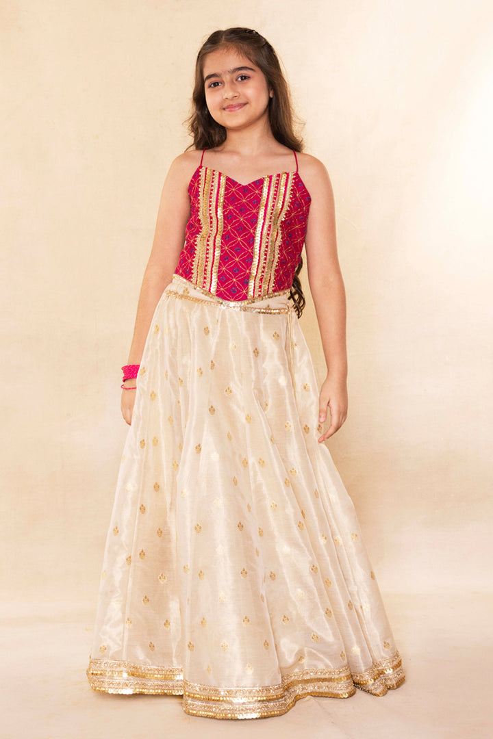 Fuchsia Corset Blouse With Embellished Cape and Gold Tissue Lehenga Set