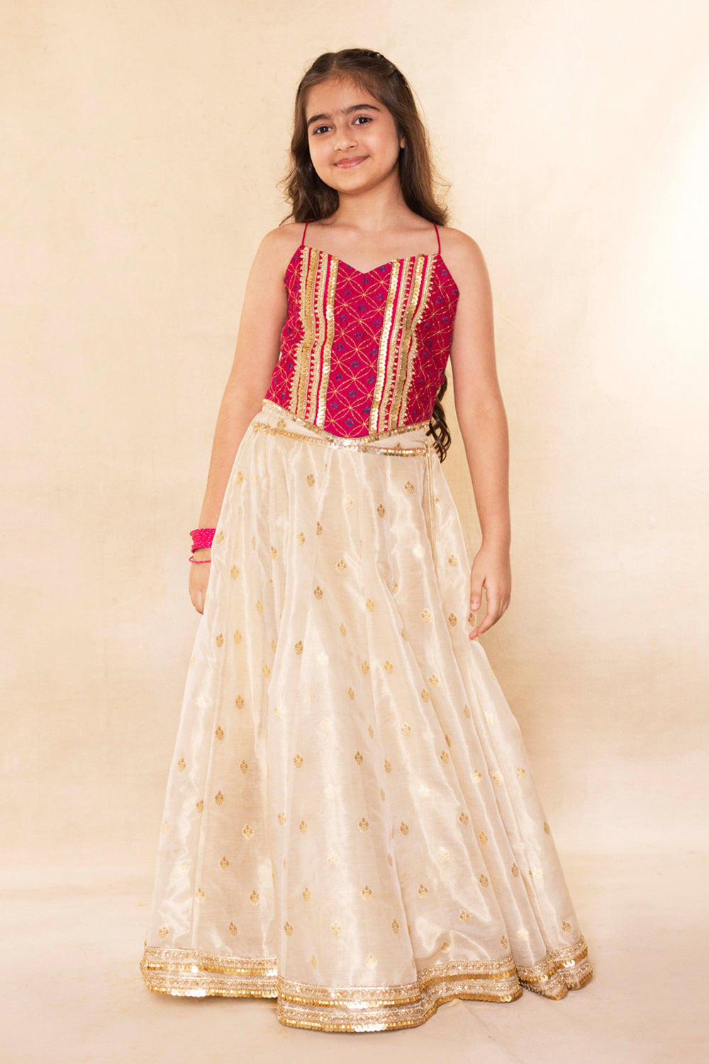 Fuchsia Corset Blouse With Embellished Cape and Gold Tissue Lehenga Set